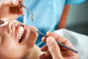 A photo of a woman getting a dental checkup