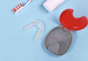Clear aligner with the case, a tooth brush, and tooth paste